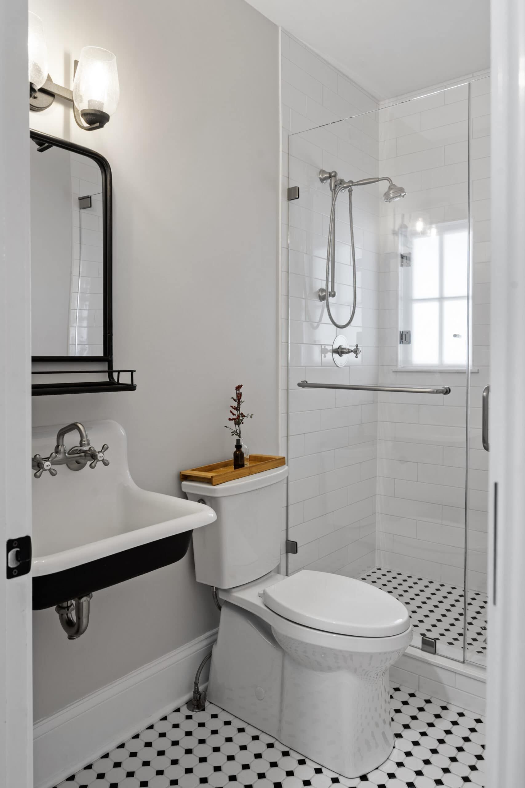 small bathroom with black and white motif